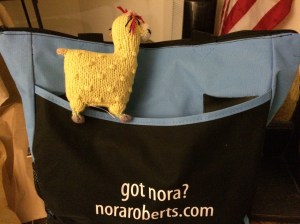 https://ttpbooks.com/ Nora's book bag holding all the books I bought and authors signed.  The stuffed animal is from the Free trade store at Harper's Ferry